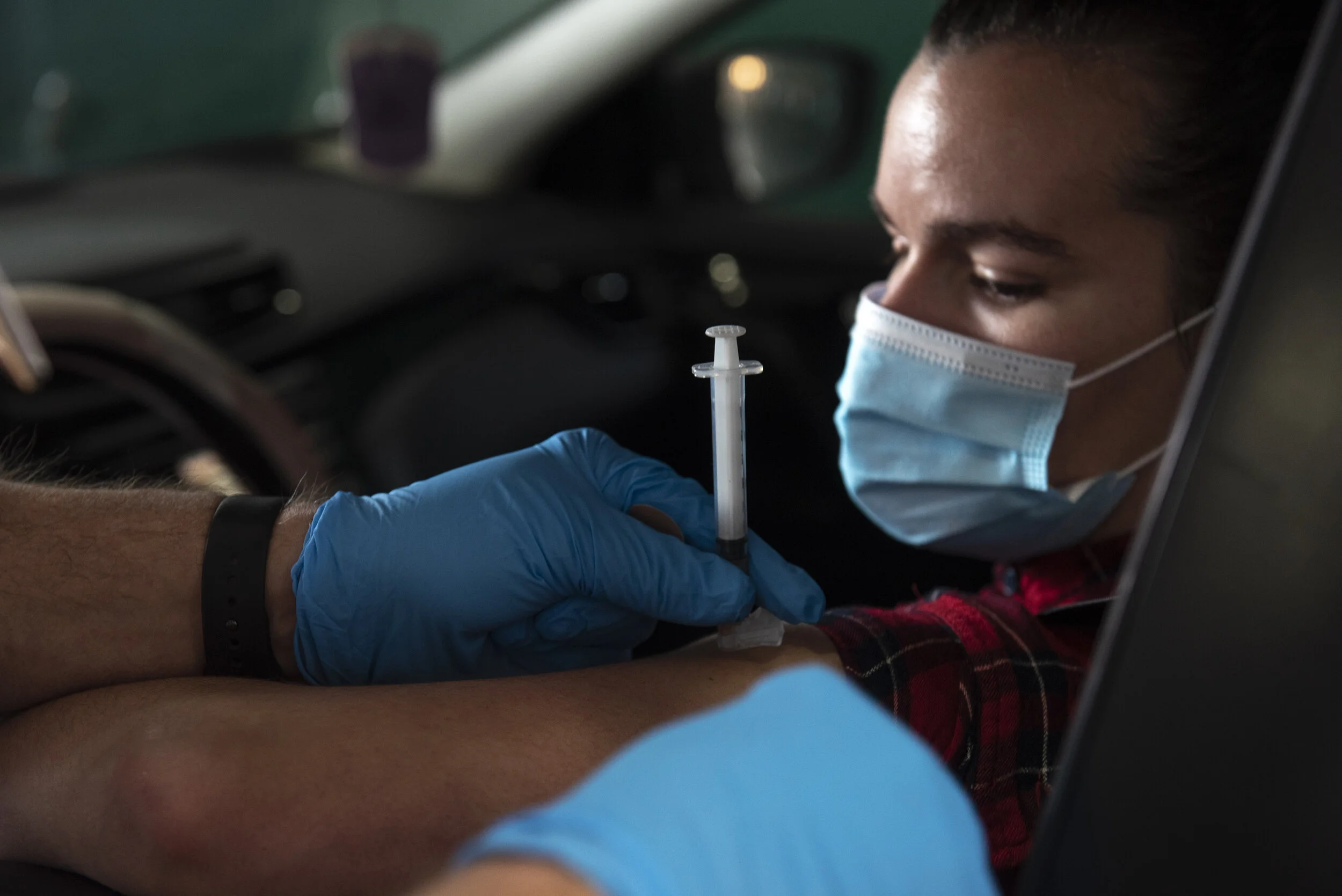  Hannah McConnell, 26, of Chesapeake receives a COVID-19 vaccine as a part of a drive-in vaccination event for healthcare workers at Oceana Volunteer Fire Department Station 8 in Virginia Beach on Tuesday, Jan. 5, 2021.  