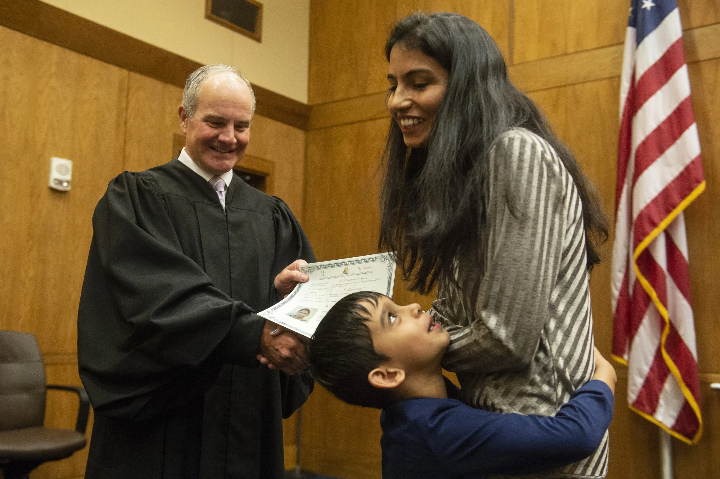  U.S. Judge Halil Ozerden presented naturalization documents to each new American citizen during a naturalization ceremony at Dan M. Russell Jr. Federal Courthouse in Gulfport on Friday, Oct. 7, 2022. 