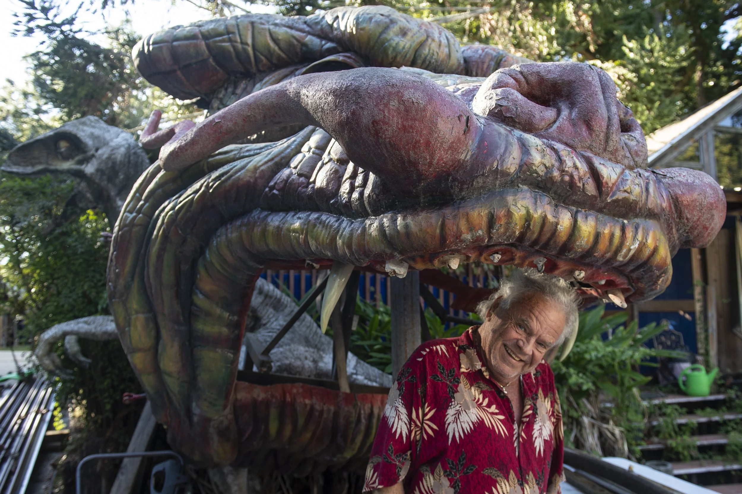  Frank Gann stands in front of the Lady Luck Casino dragon in his backyard on Tuesday, Oct. 17, 2023. Frank and his wife Marlene have had the dragon since the Lady Luck Casino closed, making small modifications and restorations to it overtime.  