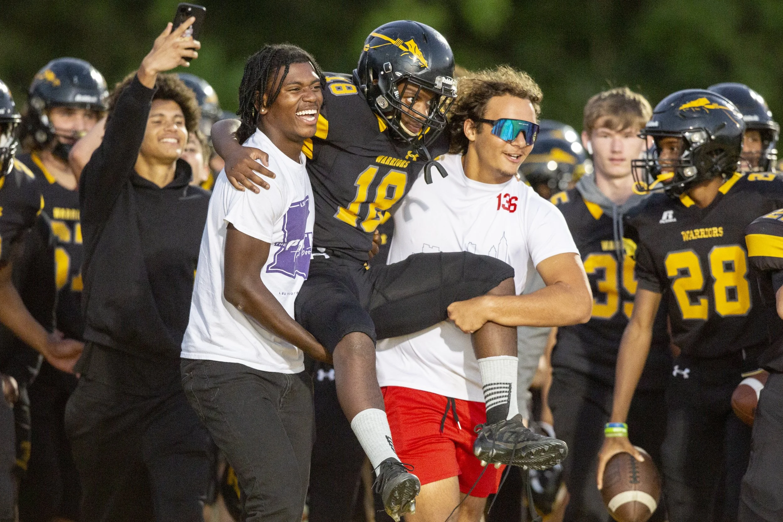  The D’Iberville JV football team carries Tyler Hunter, the student manager for D’Iberville’s JV football team after a game against St. Martin at Warrior Stadium in D’Iberville on Monday, Oct. 9, 2023. Hunter, who has an intellectual disability, play