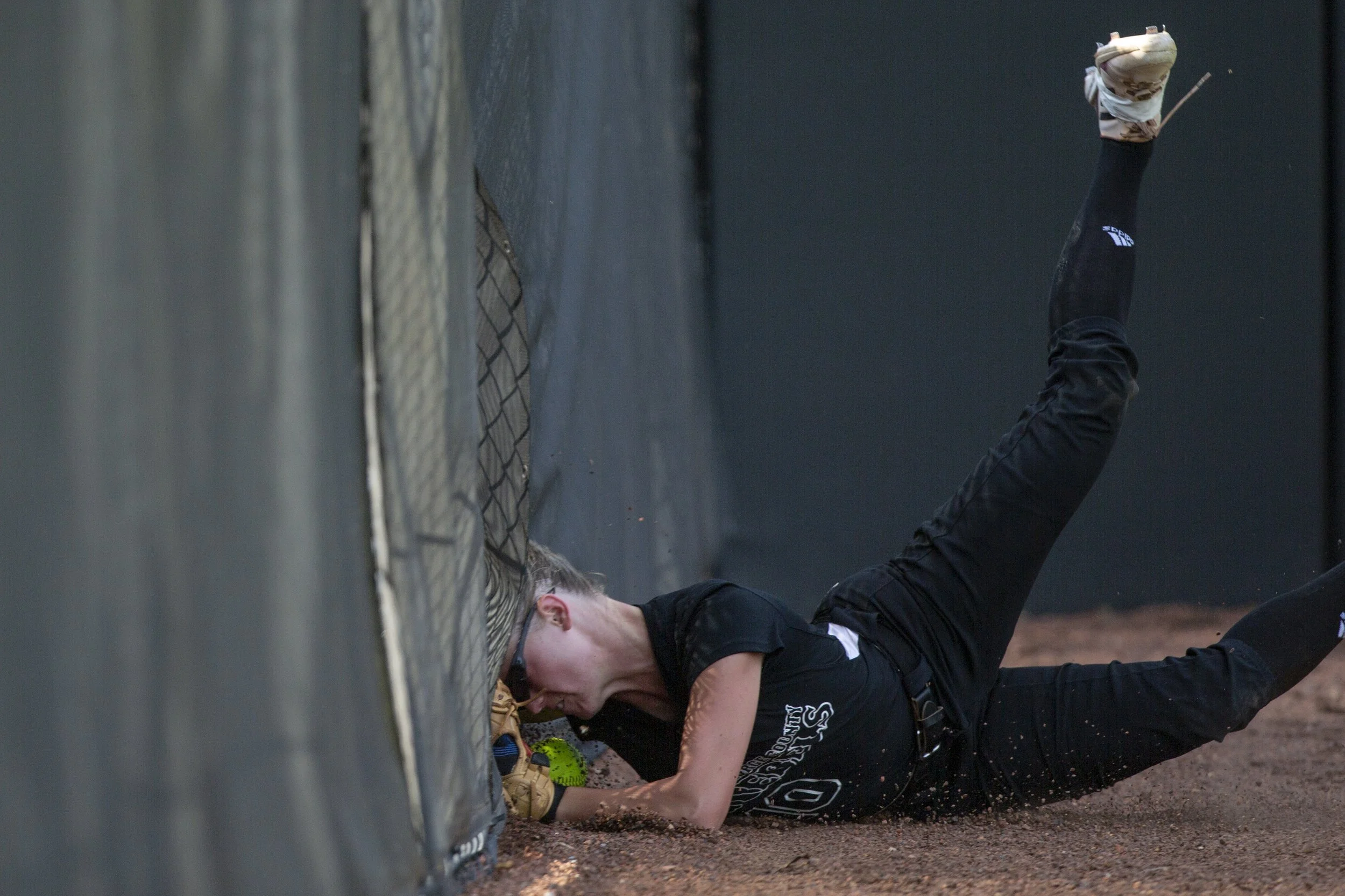  George County Lady Rebels’ Ashton Fairley runs into a fence during the 5A 2023 MHSAA Softball Championship game at USM Softball Complex in Hattiesburg on Thursday, May 18, 2023. 