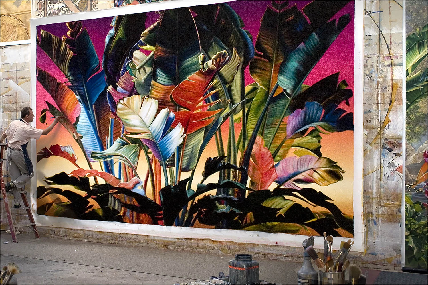 Les Seymour painting a tropical foliage, exotic theme mural on canvas. This mural is used on the interior of a yoga and meditation studio in San Francisco, CA.