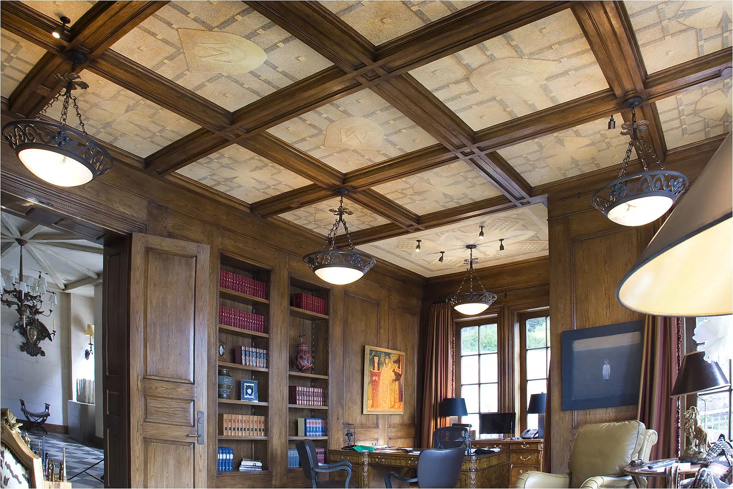  Coffered ceiling panels decorated with murals depicting a family/company crest in an office.