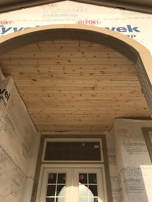 This trim around the arch will be removed as the whole front and side will be covered with stone.