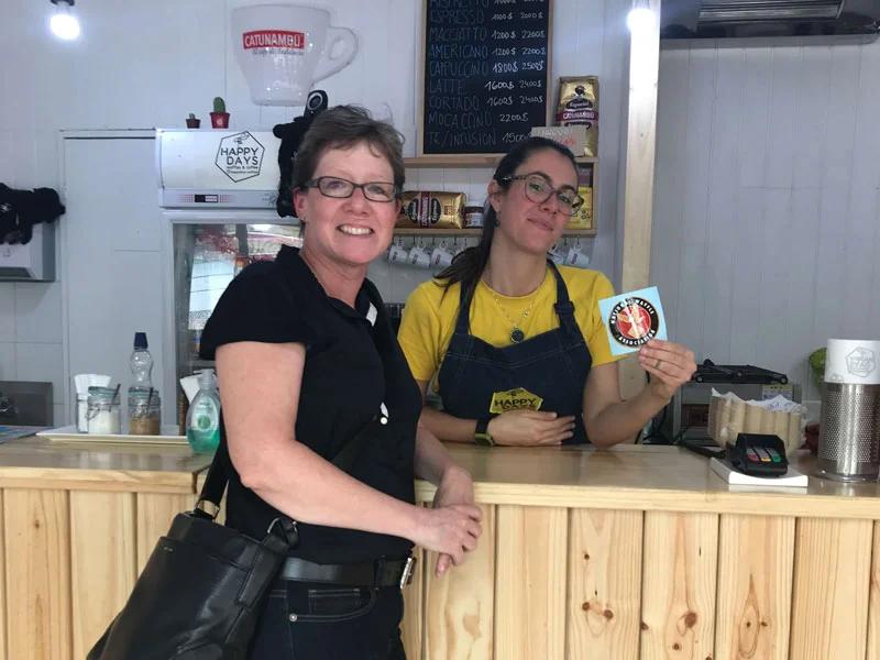 Our friend Mary during a visit to Santiago popped in at Happy Days Waffles and Coffee and made instant friends! The shop owner shown here proudly displaying her new NWA sticker!