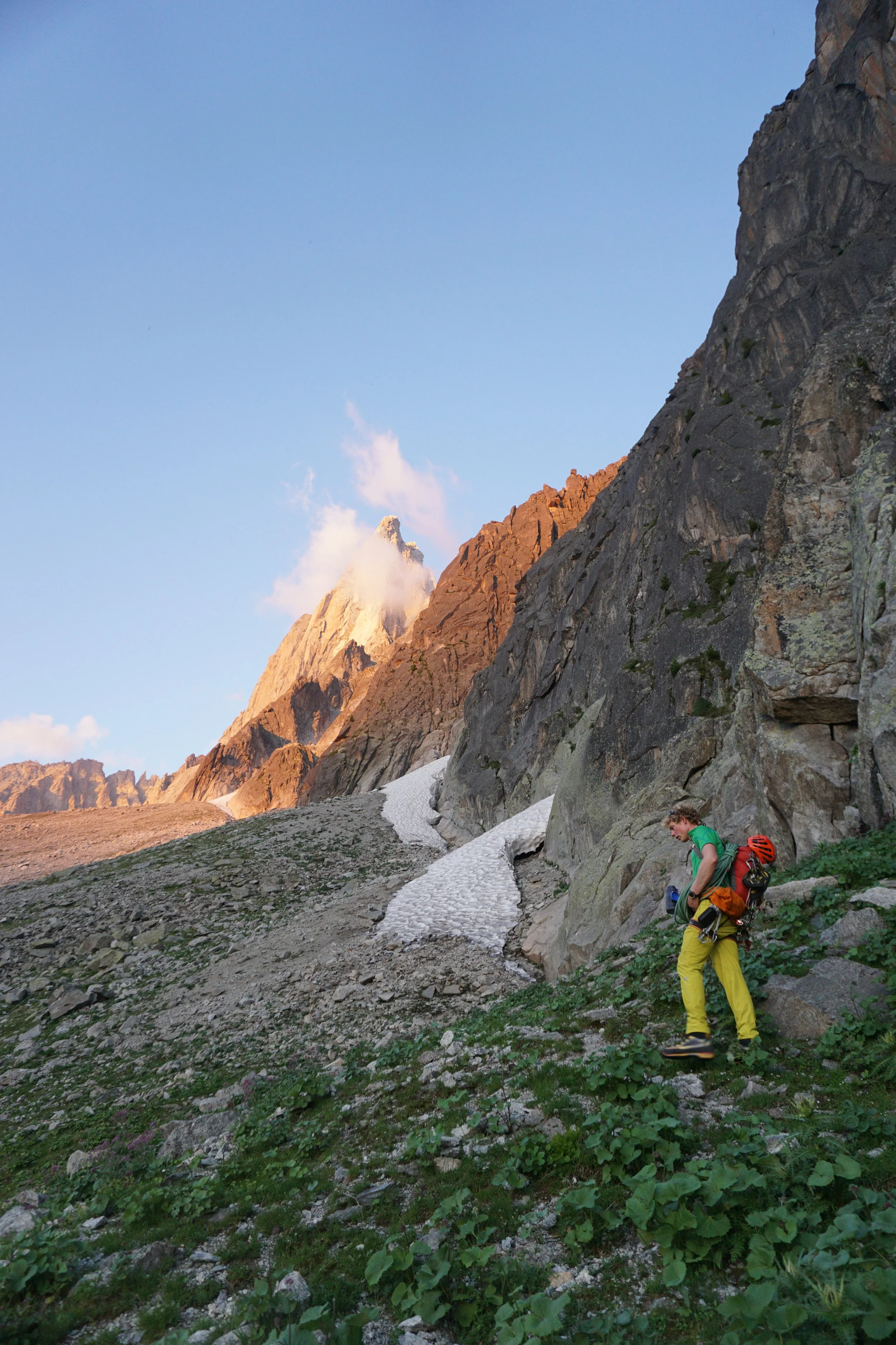 Approaching Le Dru in beautiful evening light. The downside of taking a tiny rucksack is everything hangs off it during the approach! Photo: Uisdean Hawthorn 