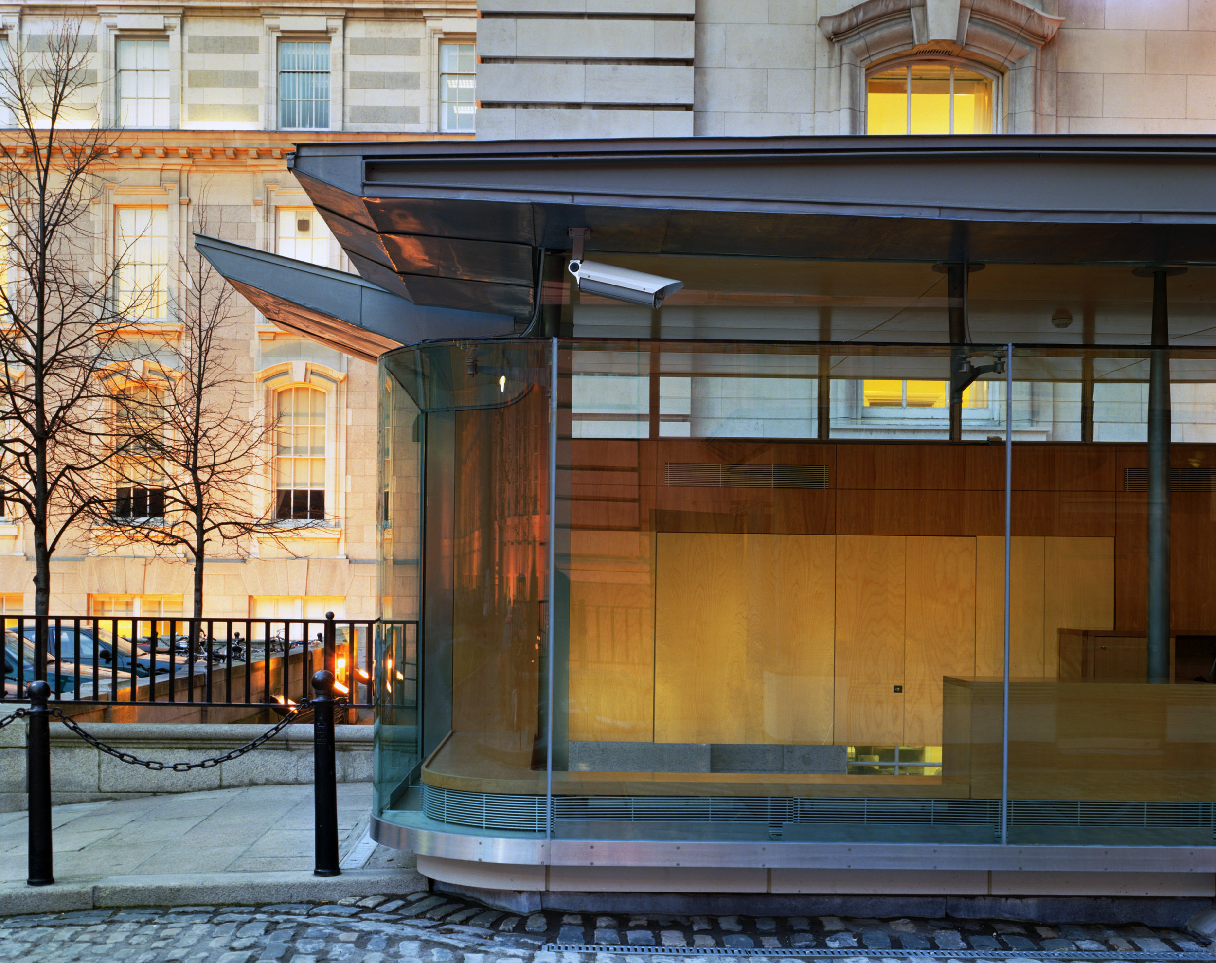 Fig. 3 Welcoming pavilion curved glass corner with suspended roof structure