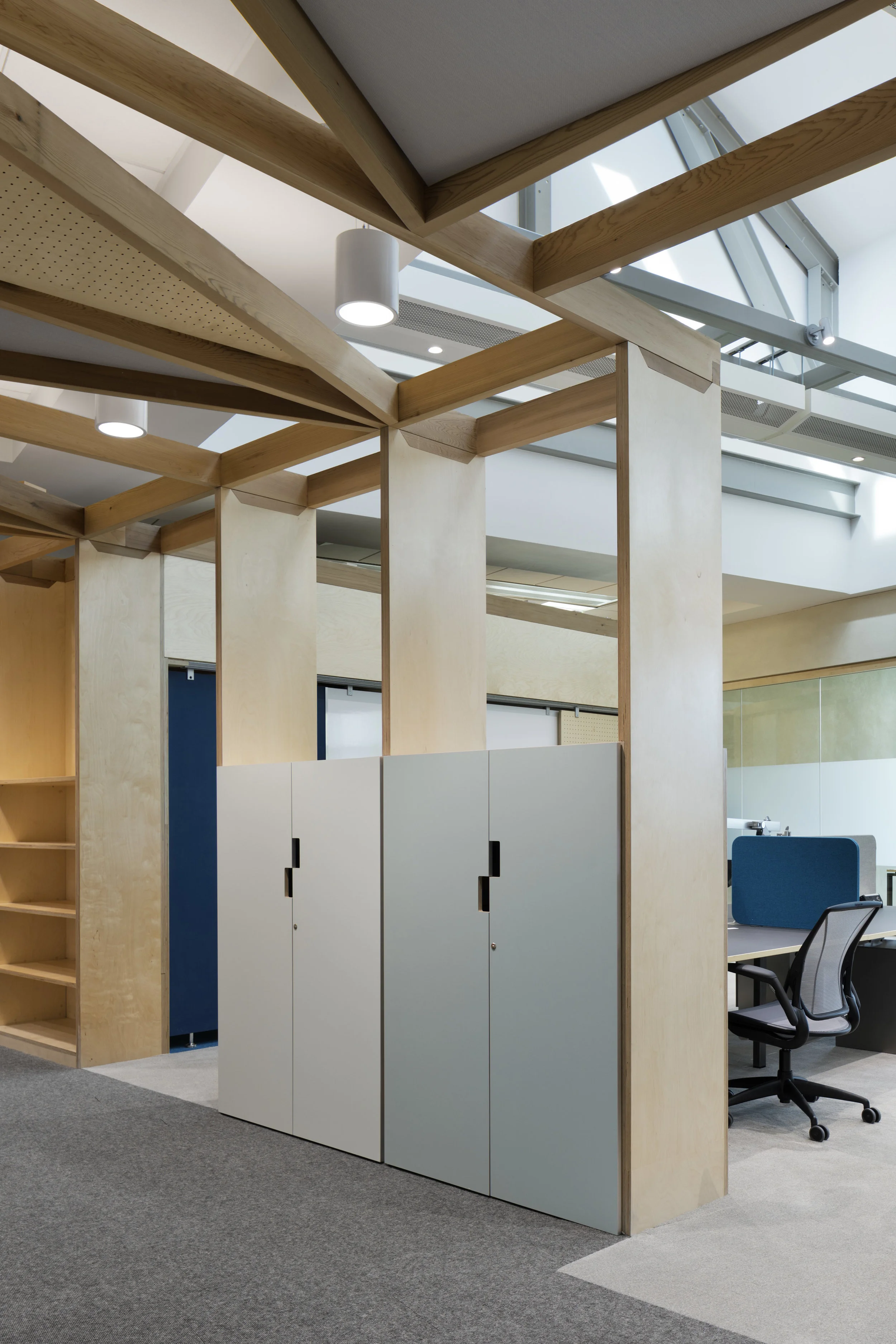 Fig. 8 Integrated storage and timber acoustic ceiling system with desk space adjacent