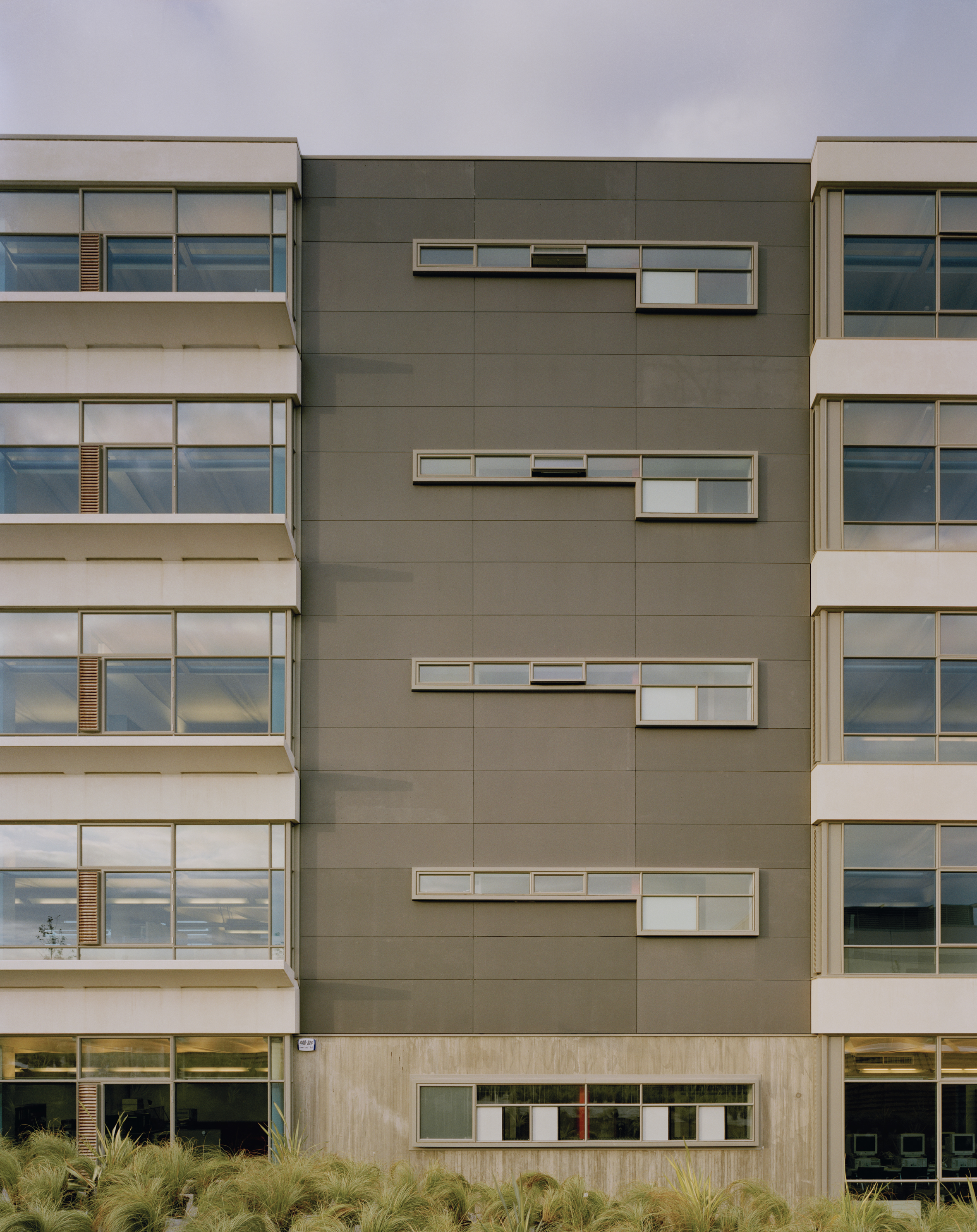 Fig. 12 North facade, precast light shelves and service core