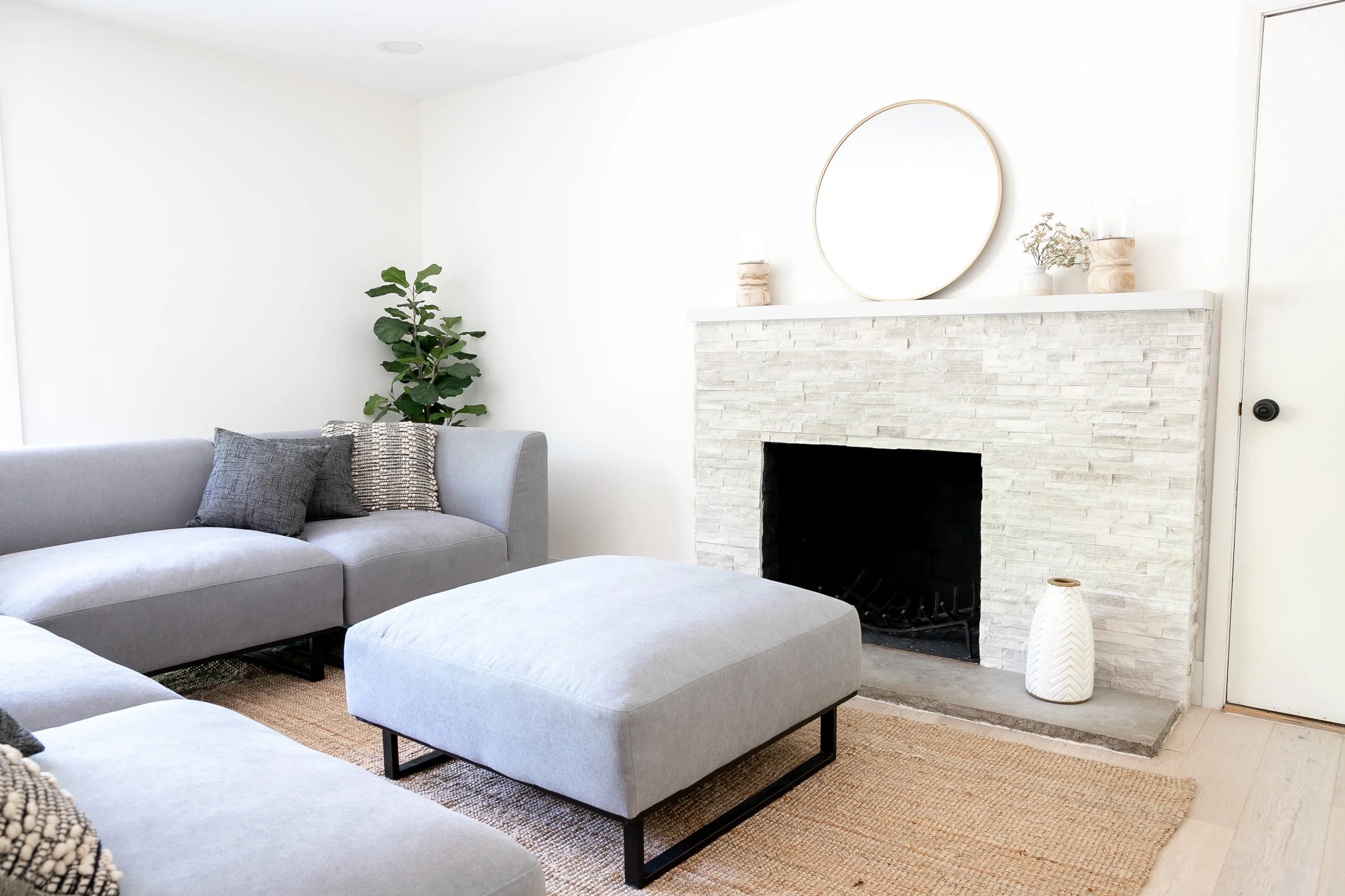 Rug: IKEA | Sectional: Midwest Discount Furniture | Mirror: Target | Vase: Crate & Barrel