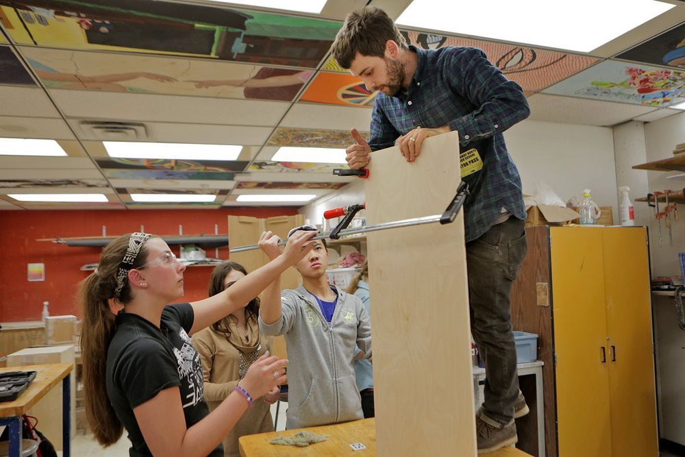 Emanuel of Citizen Carpentry teaches students to build art displays at Parkway North HS