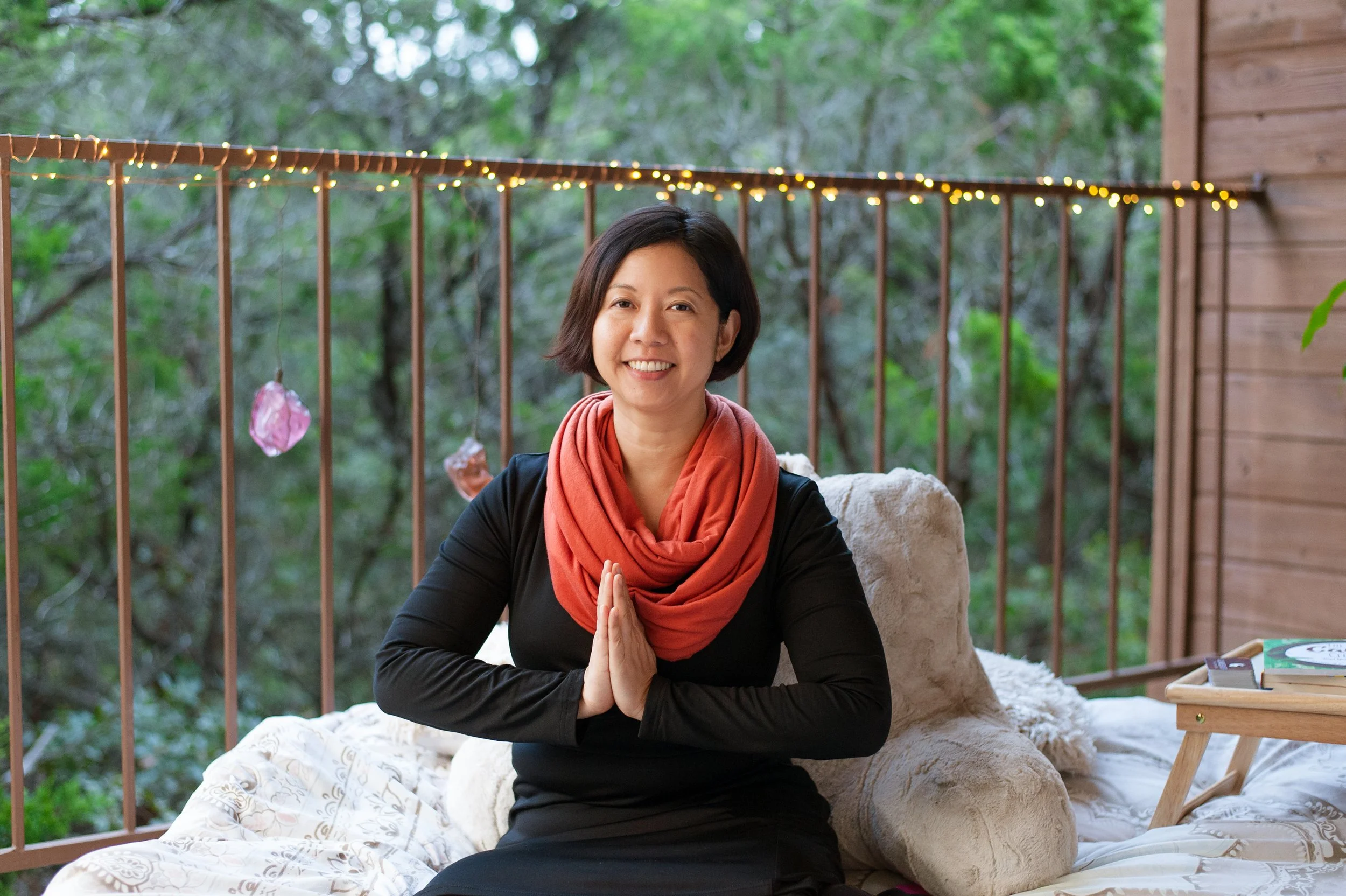 Dr Lynn Chang of Career Zen with prayer hands smiling in Austin TX