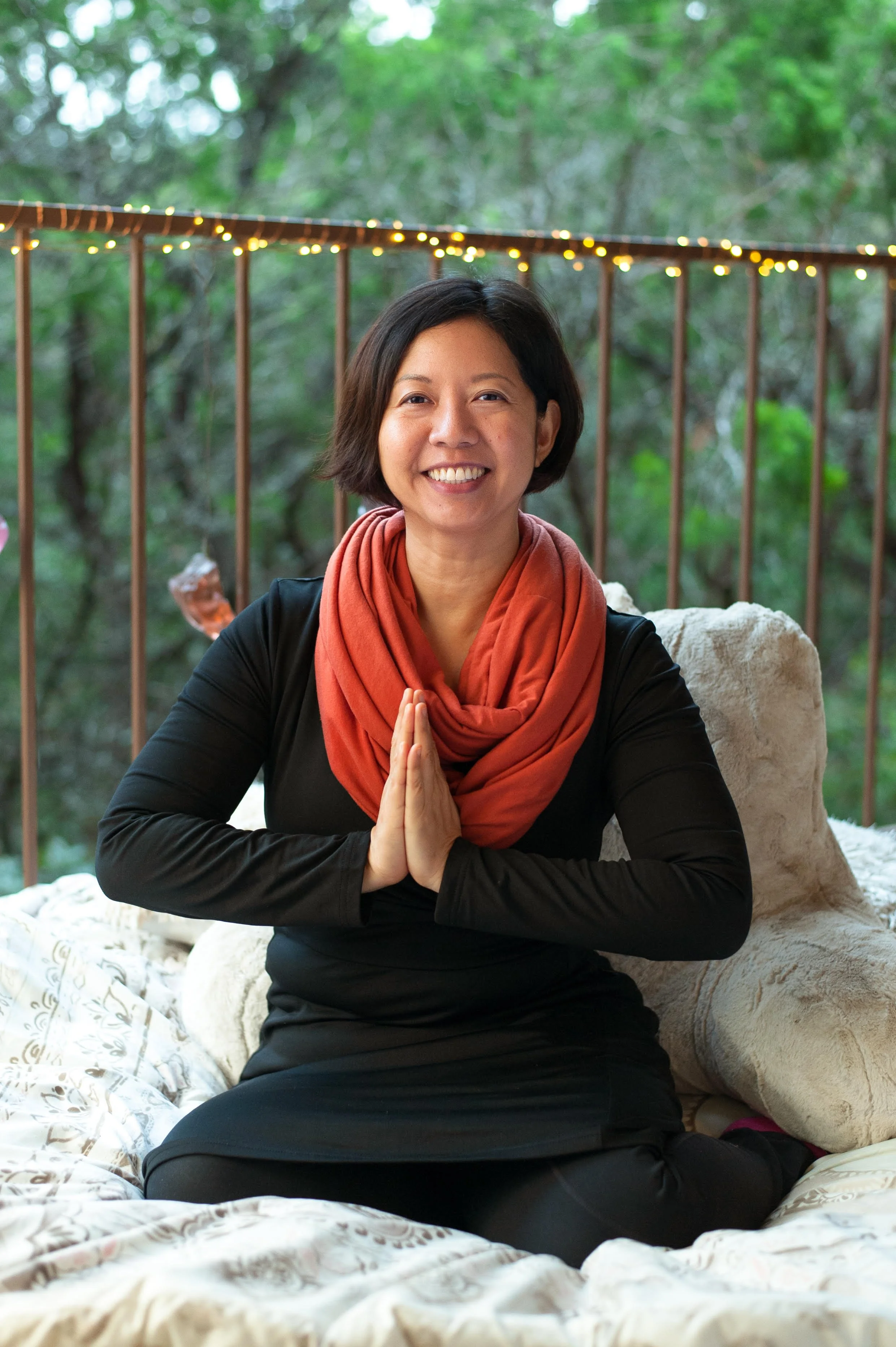Dr Lynn Chang of Career Zen in prayer hands and smiling