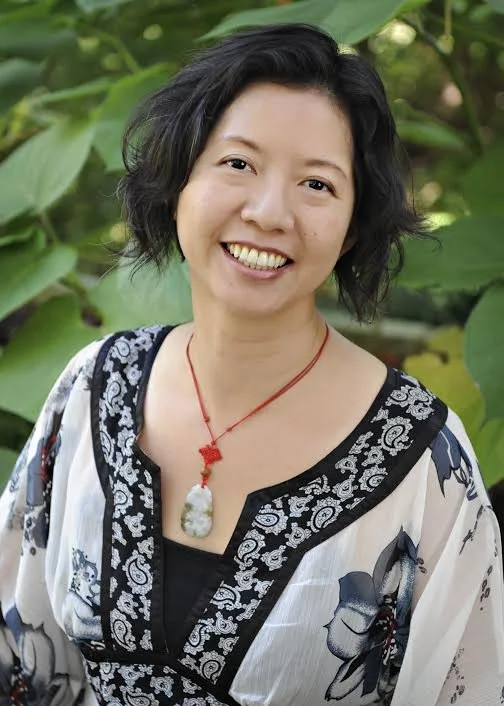 Dr Lynn Chang of Career Zen smiling in a garden in Austin TX