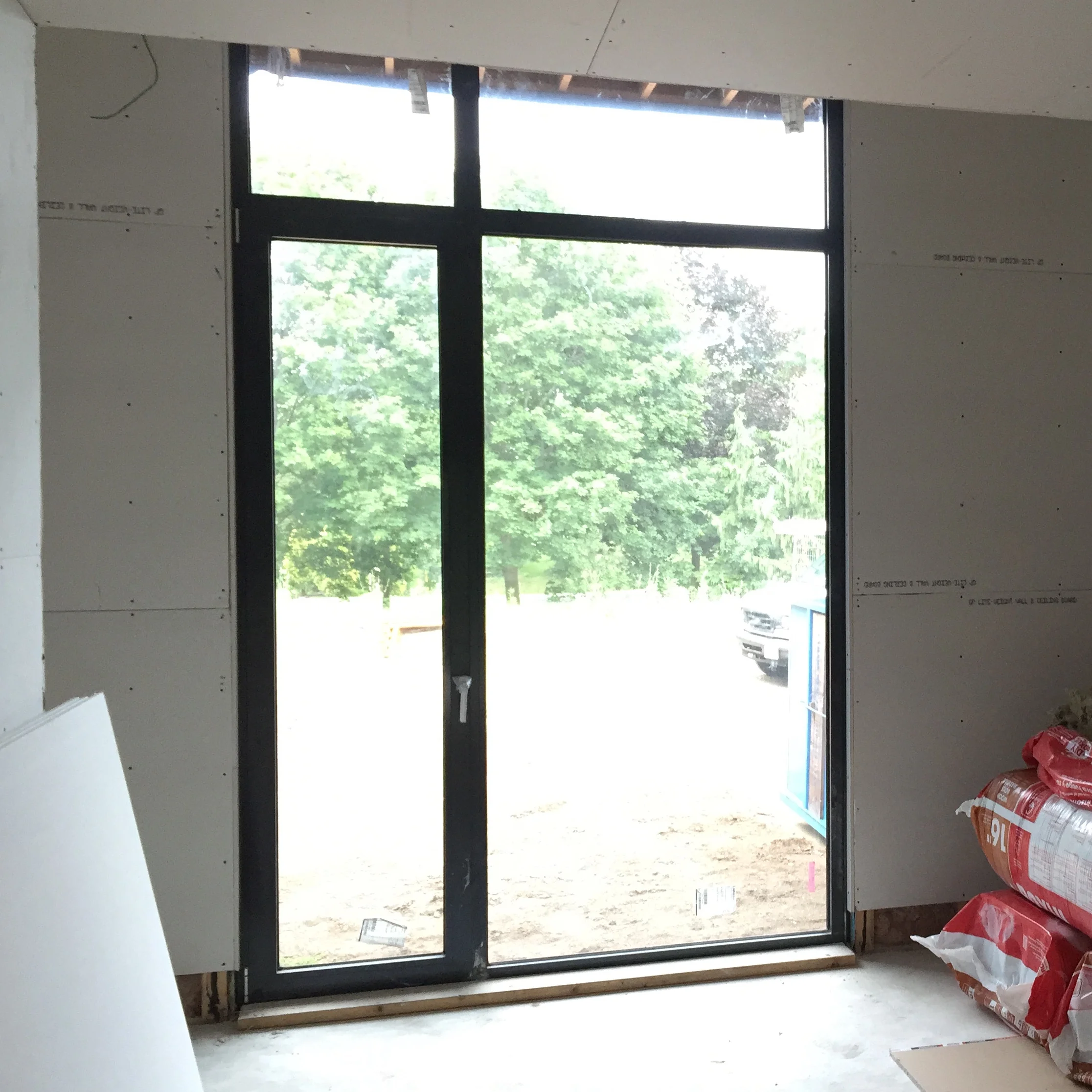 Interior view of fixed with tilt & turn window with transoms above.