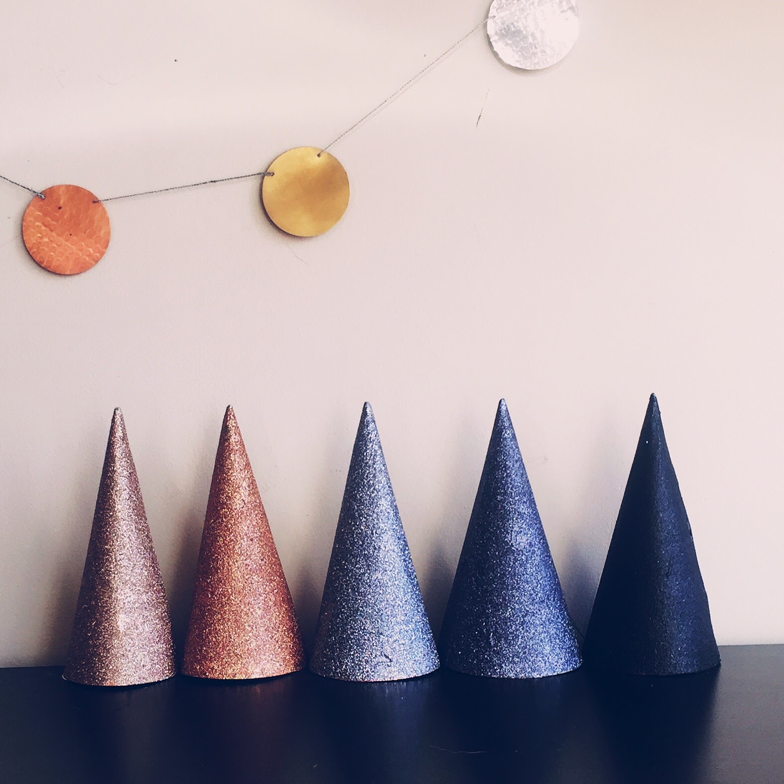 DIY metallic ombre glitter party hats for a classy 30th birthday