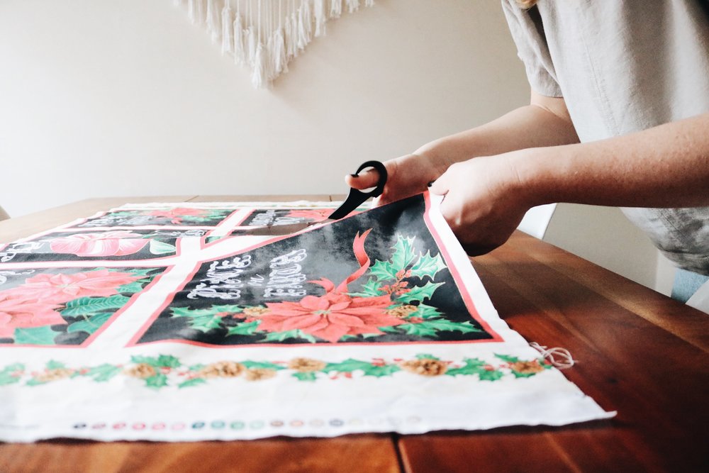 Cutting Christmas fabric for DIY appliqué turtlenecks