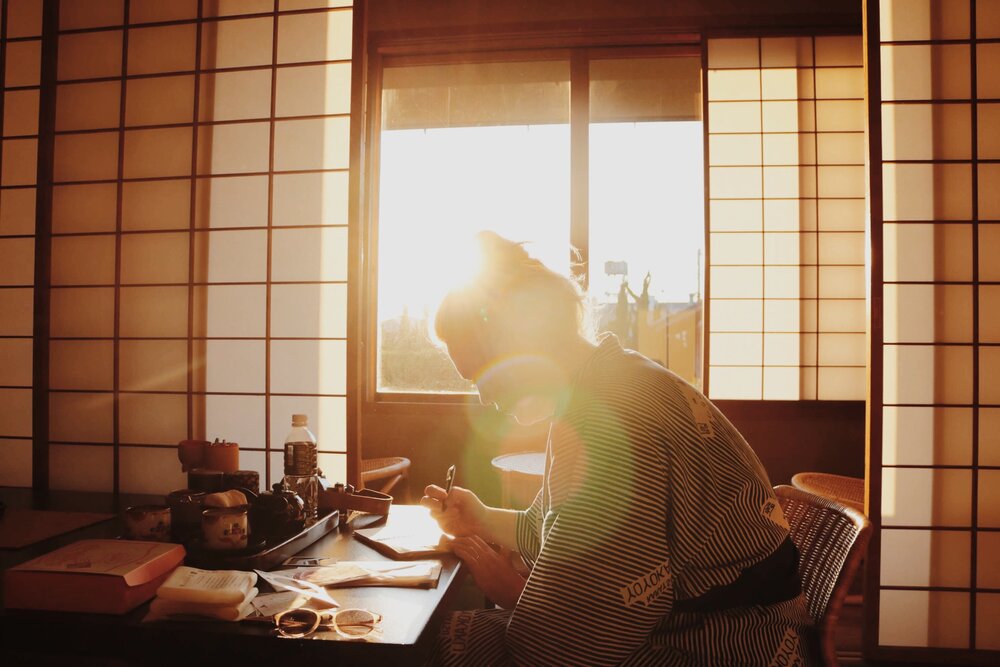 writing in the sunrise in a ryokan