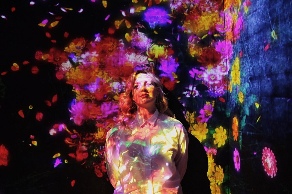 becoming part of the lights at teamlab