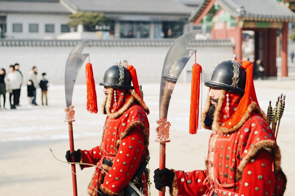 traditional soldiers guarding a palace in Seoul South Korea