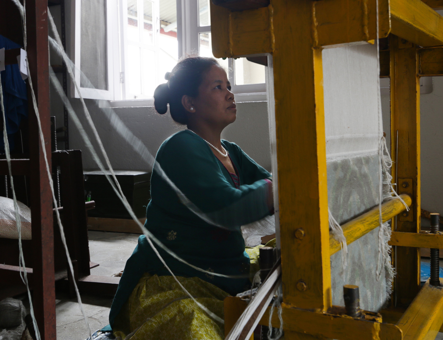 A rug weaver at the loom