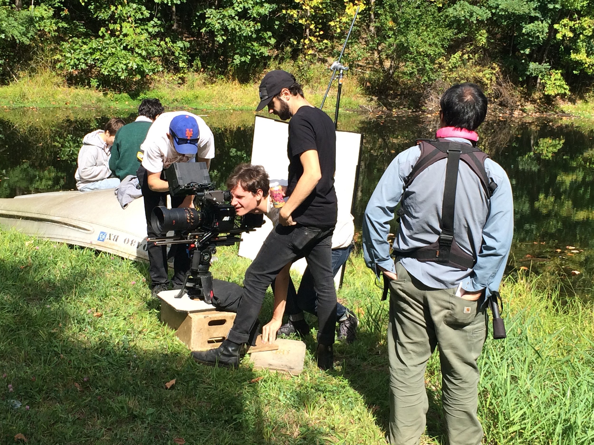 Director Ryan Schnackenberg reviewing a shot on the set of "On Earth"