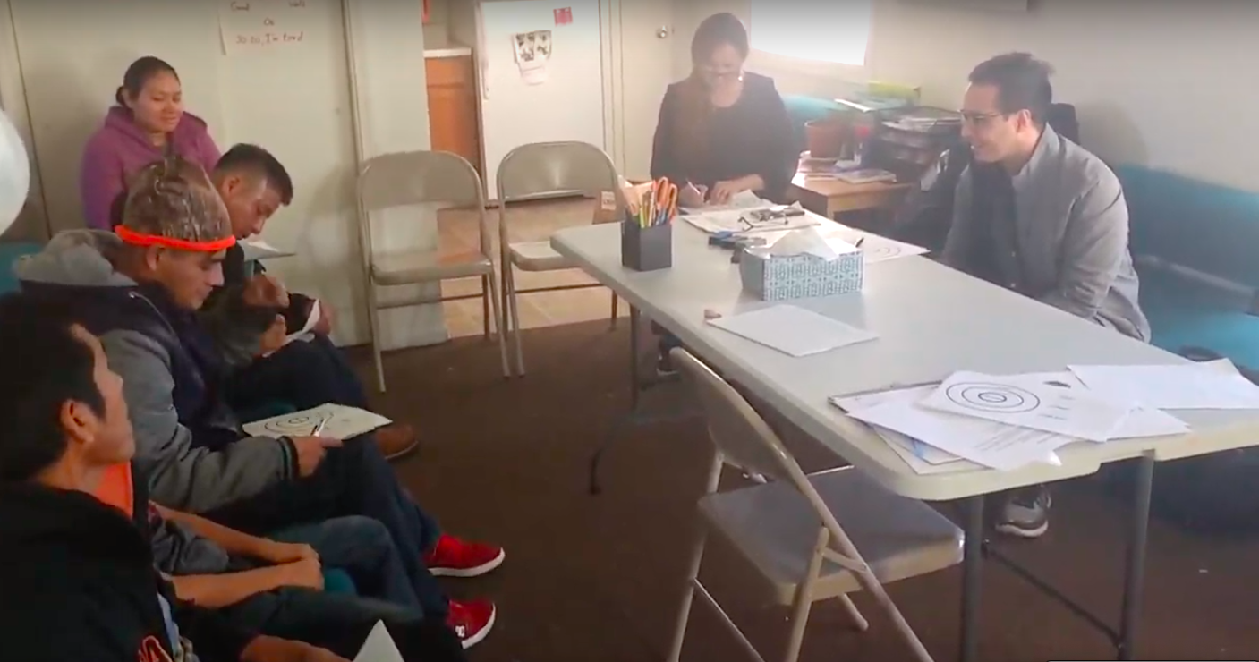 Pictured: Volunteer communications consultant, Rolando, working with a group of Guatemalan immigrants on their business planning for a volunteer consultant.