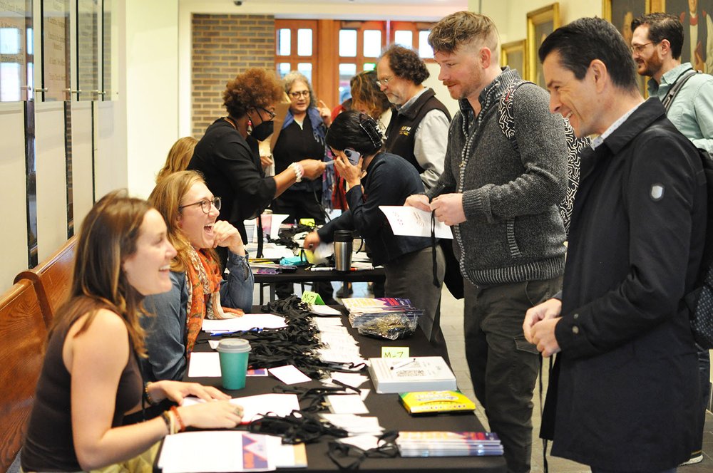 Attendees register at 2023 Union Co-op Symposium.jpg