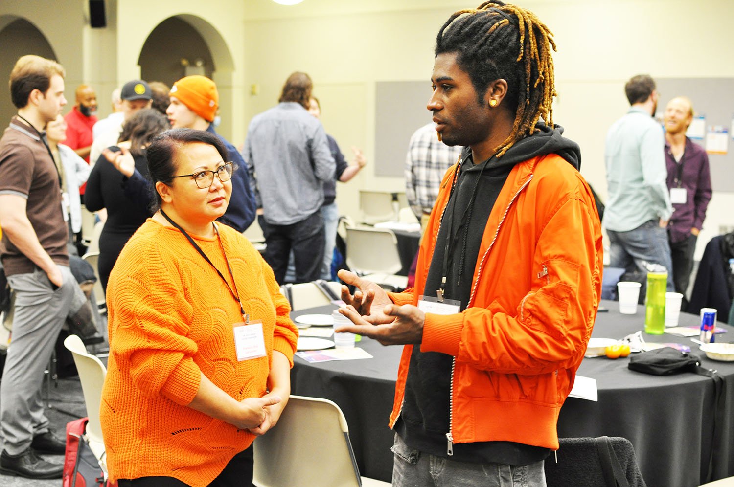 Attendees chat at 2023 Union Co-op Symposium.jpg