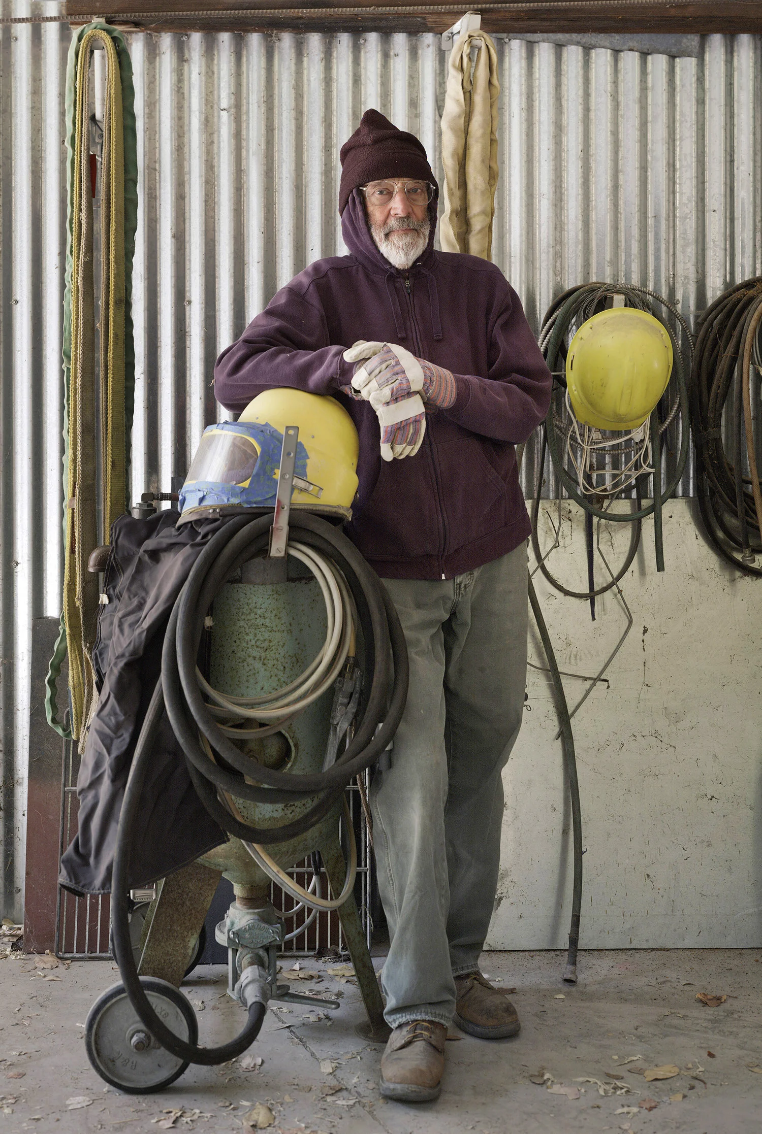 Alan Shepp in his studio with sandblasting equipment, Napa Valley, California, 2013