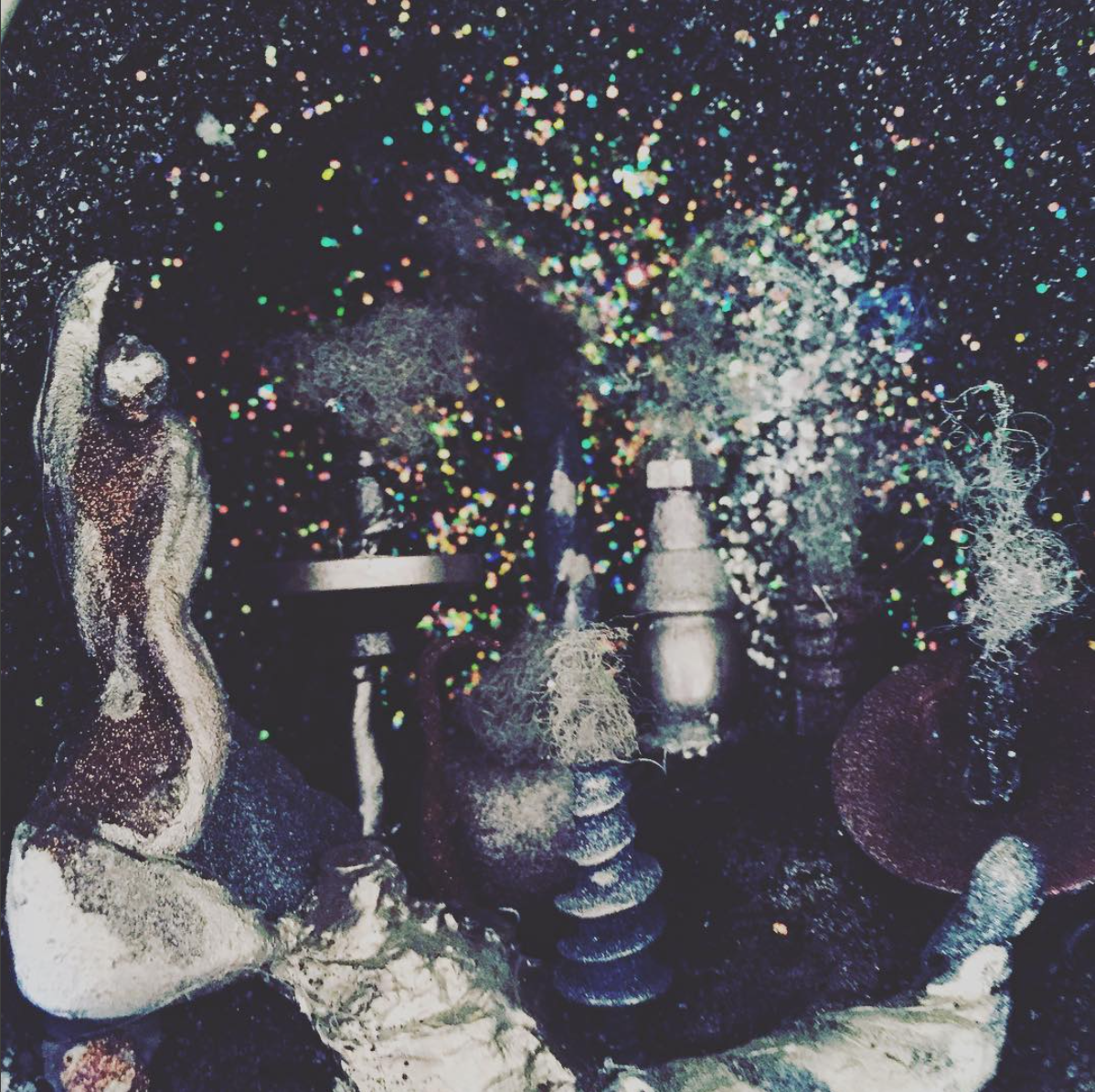 Detail of orb city. Materials: found objects, glitter