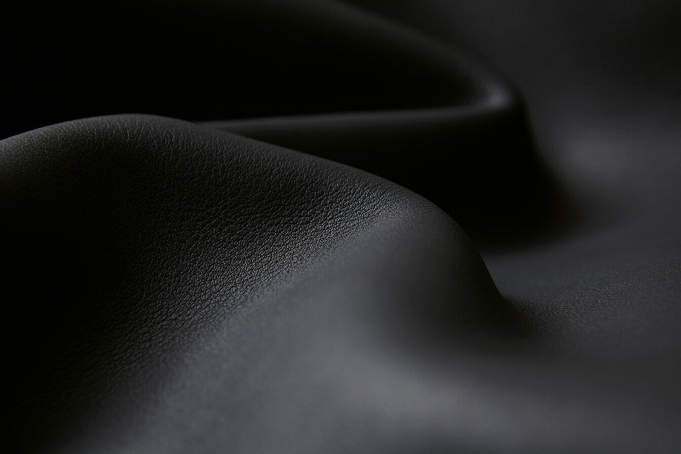 Oliver Ruuger black leather. Close up grain and texture.