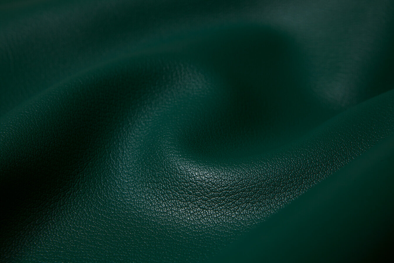 Oliver Ruuger green leather. Close up grain and texture.