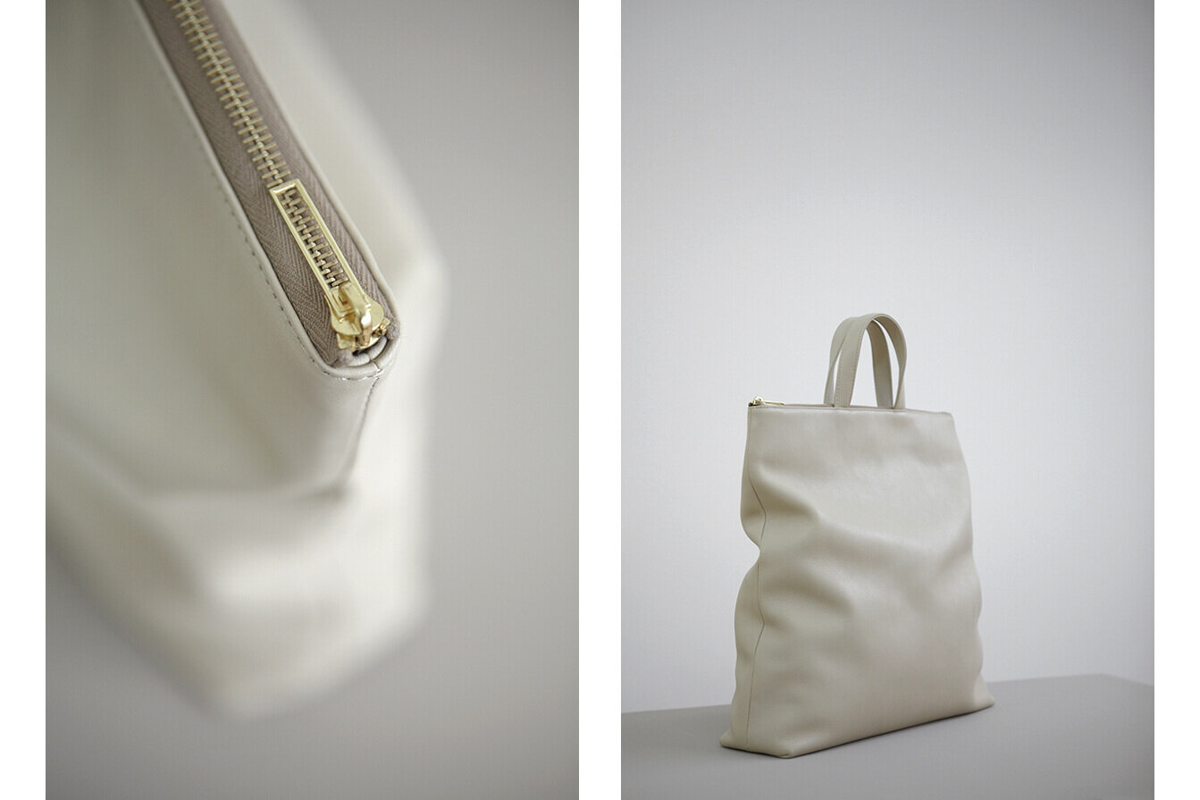 Tsatsas white leather tote bag with close up of the zip. Ecommerce product images.