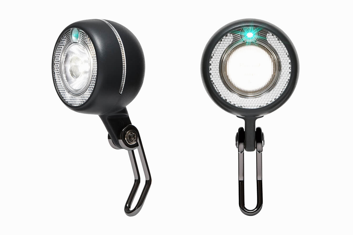 Two Beryl front bike lights. Laser beam visible. Ecommerce products.