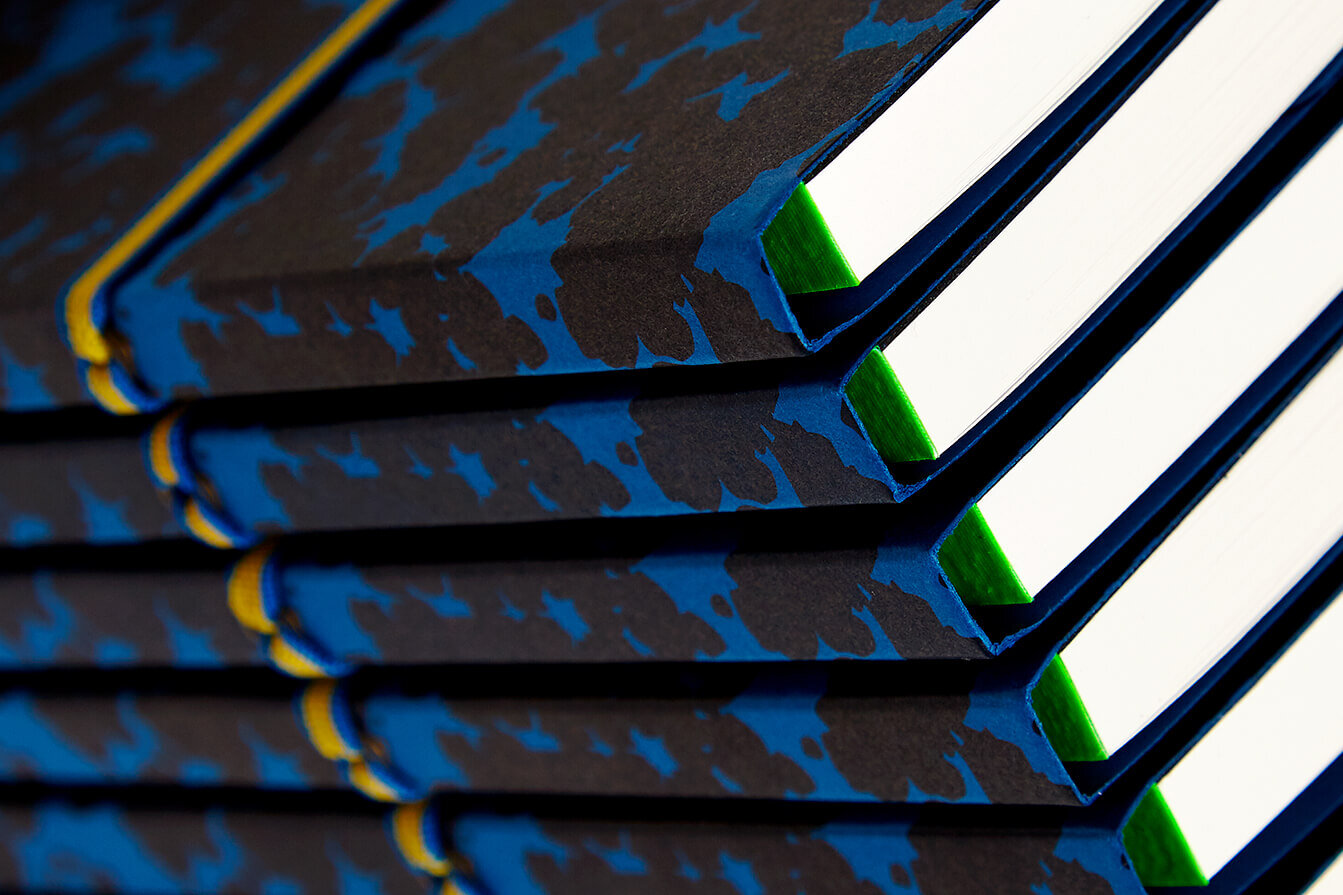 Not Another Bill notebook stack. Ecommerce product image. Blue and Black.