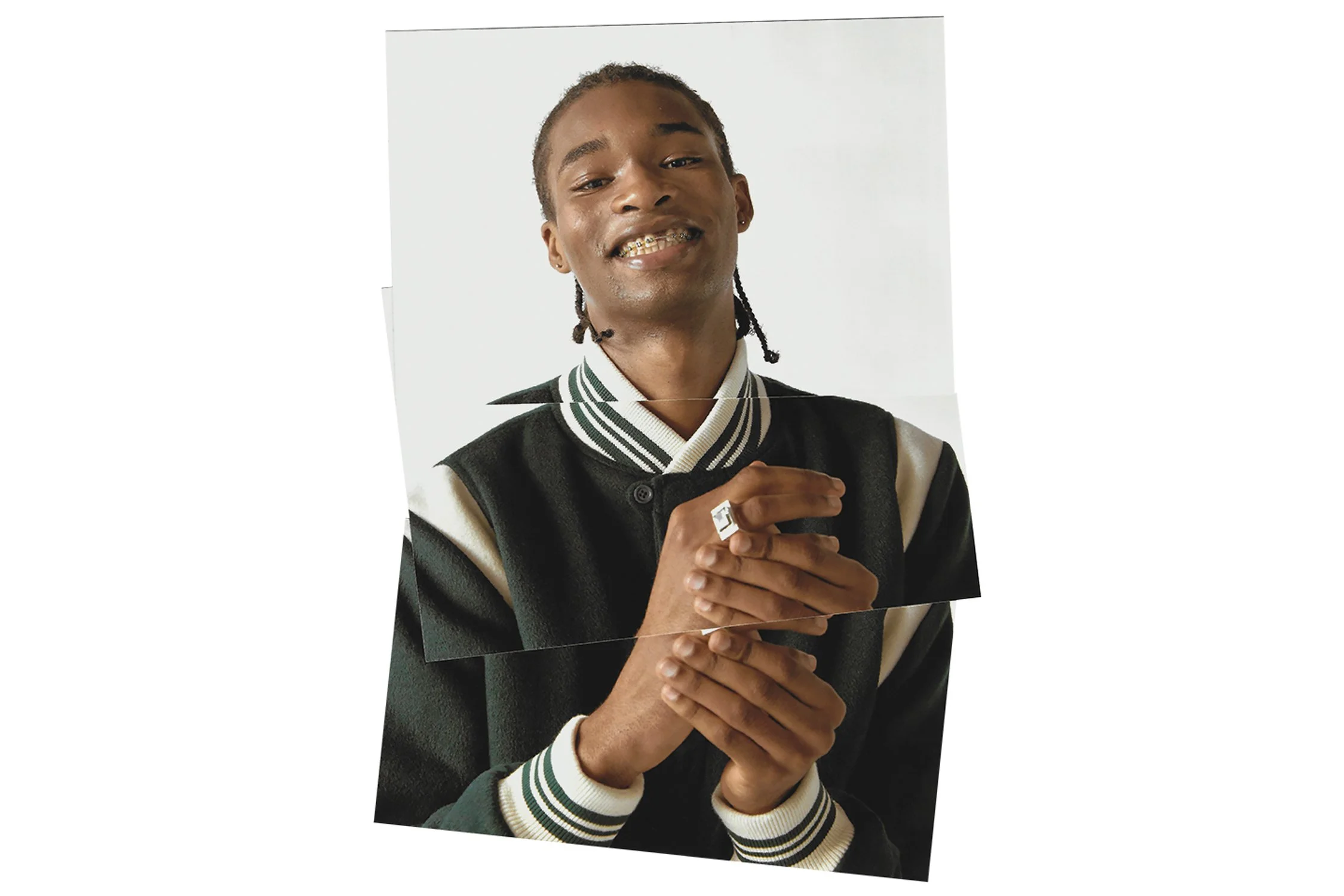 male model wearing bomber jacket, rubbing his hands together on a white background.