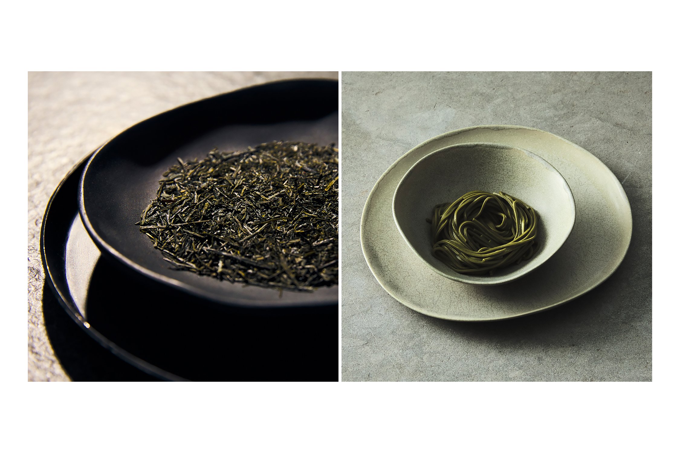 two plates of noodles and tea photographed on a grey table. sayuri tea blend on black plate.