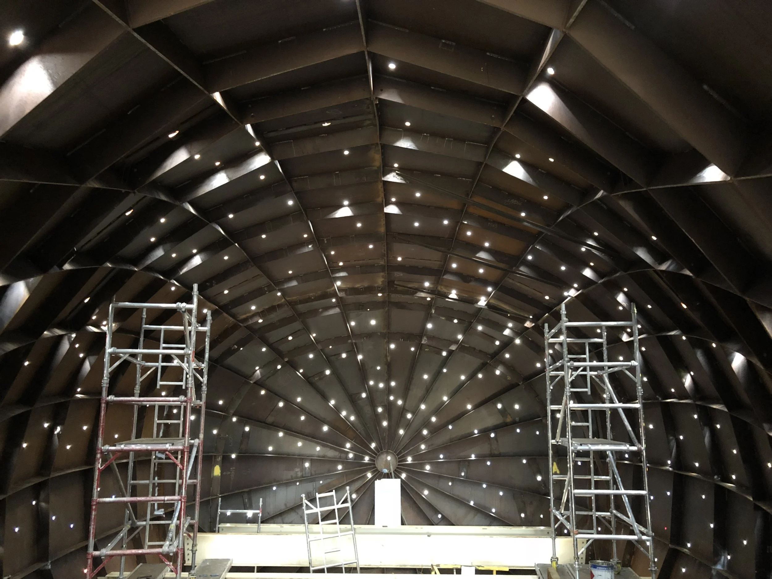 The raw interior during the fibre-optic installation phase.