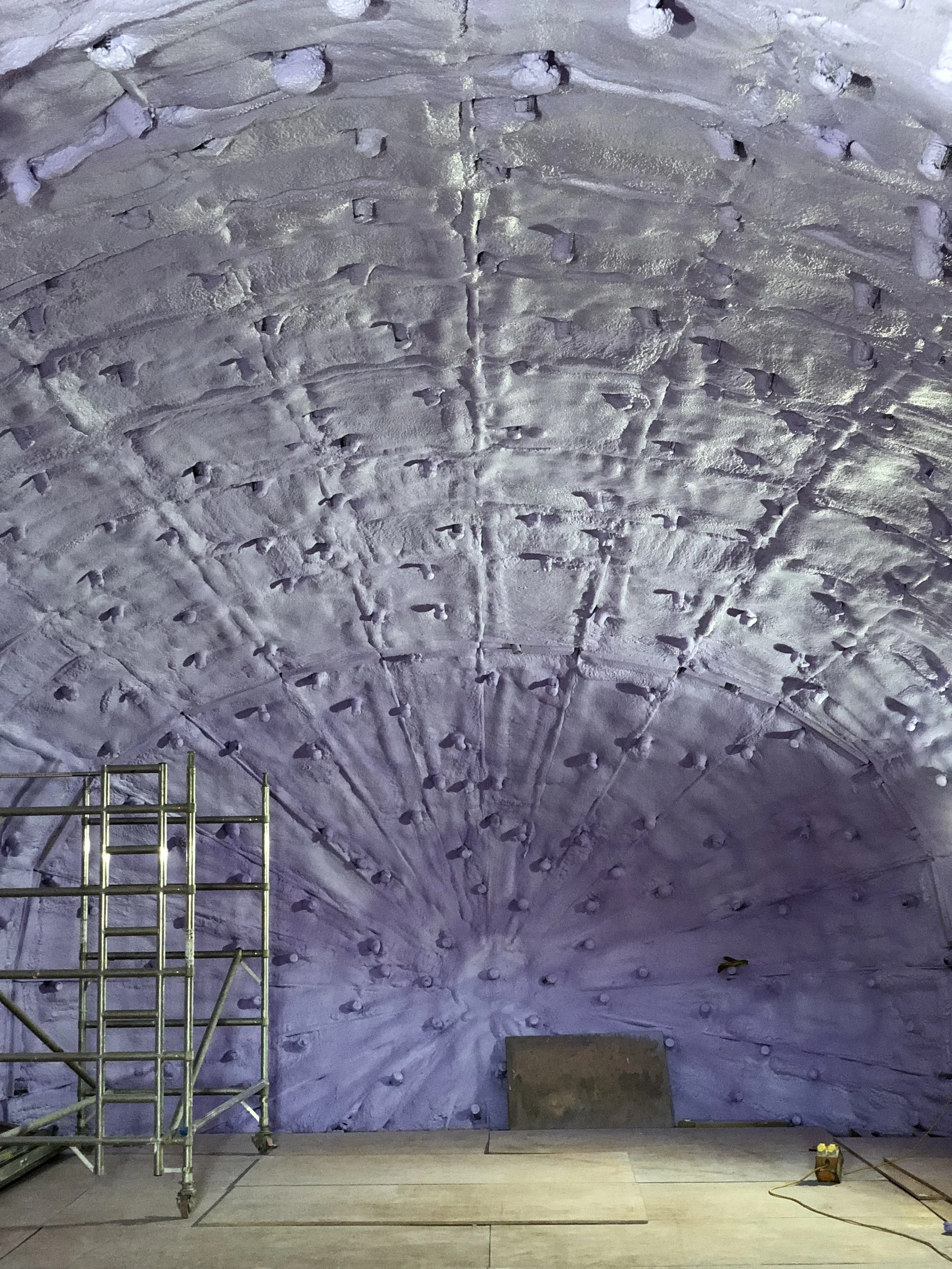 The first of 2 spray-foam coatings applied to the interior of the steel shell.