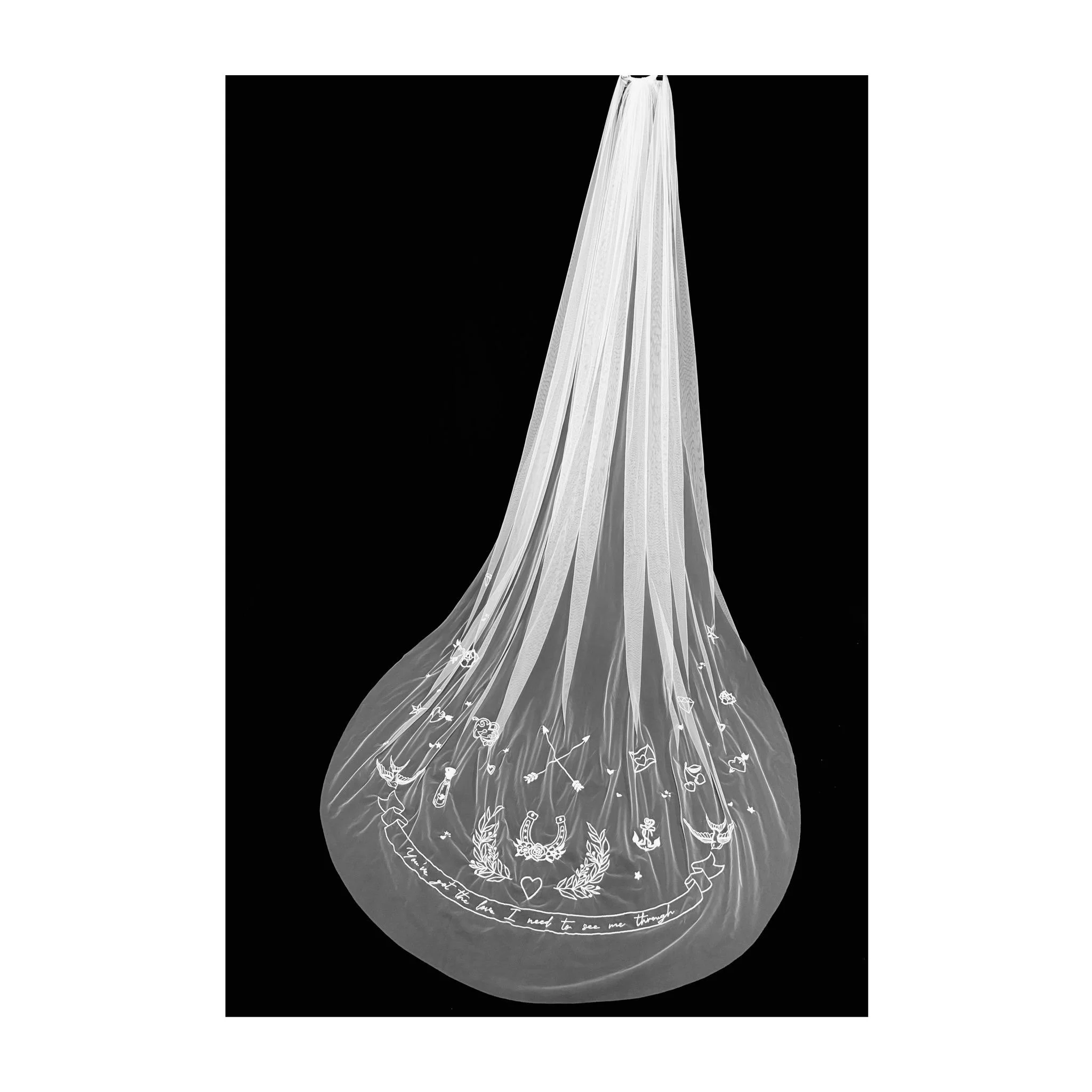 'Songbirds' Bespoke Embroidered Tulle Bridal Veil by Jenny King.  Hand embroidered Love song Lyrics and Tattoo motifs for a wedding with edgy cool style