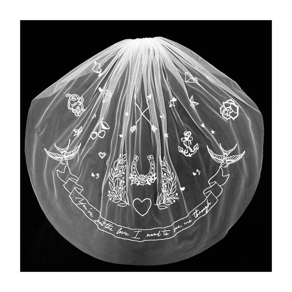 'Songbirds' Bespoke Embroidered Tulle Bridal Veil by Jenny King.  Hand embroidered Love song Lyrics and Tattoo motifs for a wedding with edgy cool style