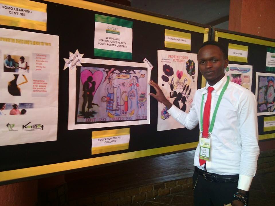 Wycliffe Displaying his Poster at the Segal Family Foundation Annual Meeting