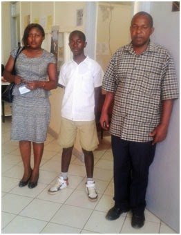 Benard Mwengi with his teachers at the EFAC office, Africa Nazarene University