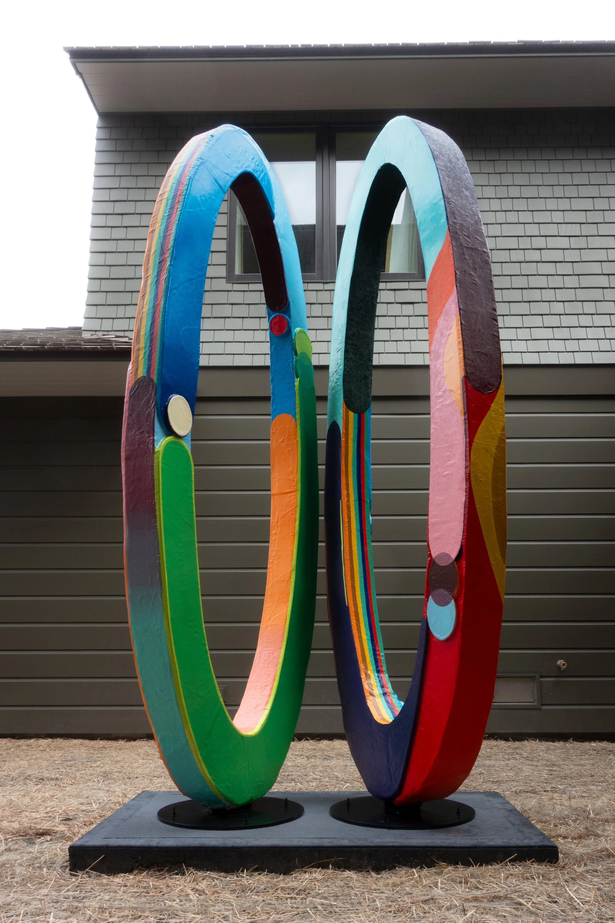   Portal: We Can Make What Home Will Become   124”x55”x55”, Insulation Board, Fiberglass, Mural Paint, Exterior Varnish, Steel Base and Armature, Notes on Paper Buried Inside the Sculpture, 2026 