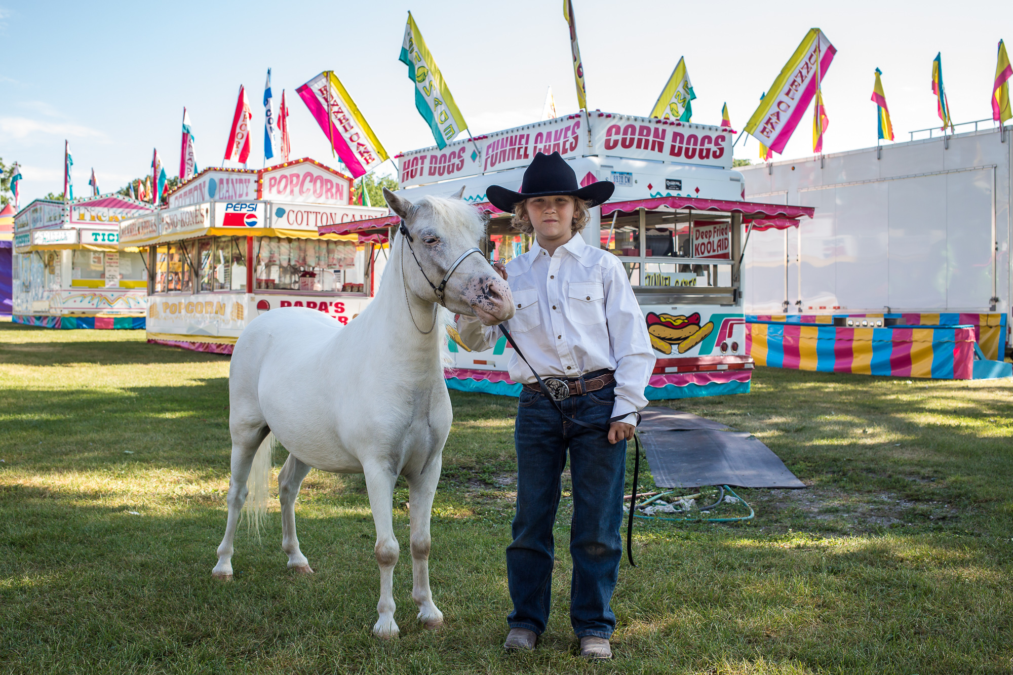  Gage Koster, 11, with Chase, a miniature Appaloosa, at the Hamilton County Fair on Wednesday, July 24, 2013 in Webster City, IA. 