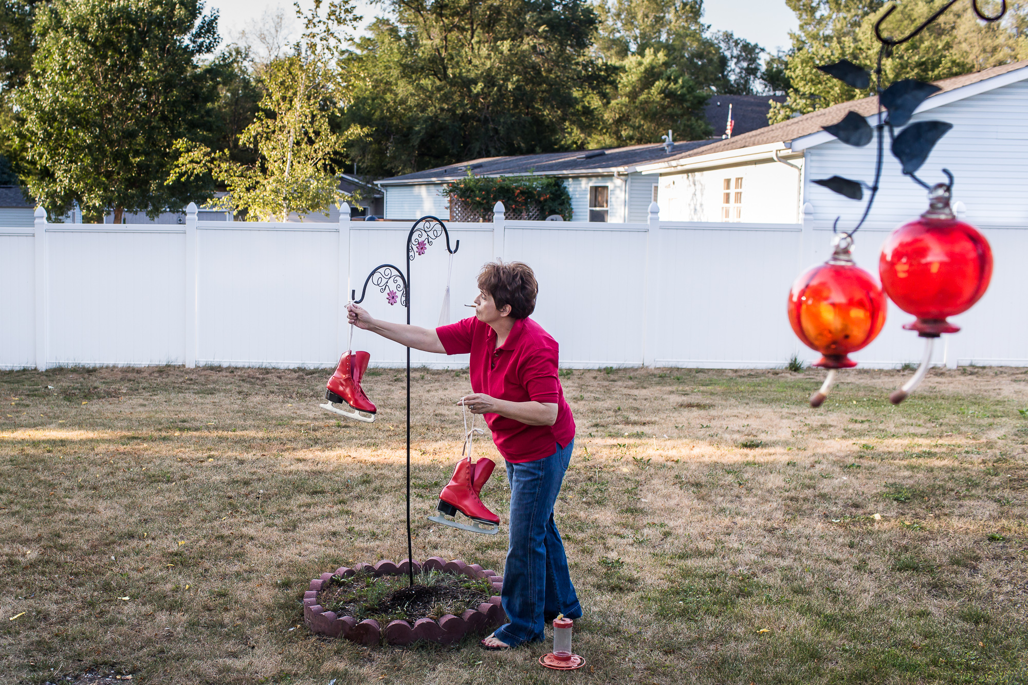  Charlene Worrick retrieves recently painted ice skates hung out to dry on Monday, July 16, 2012 in Webster City, IA. 