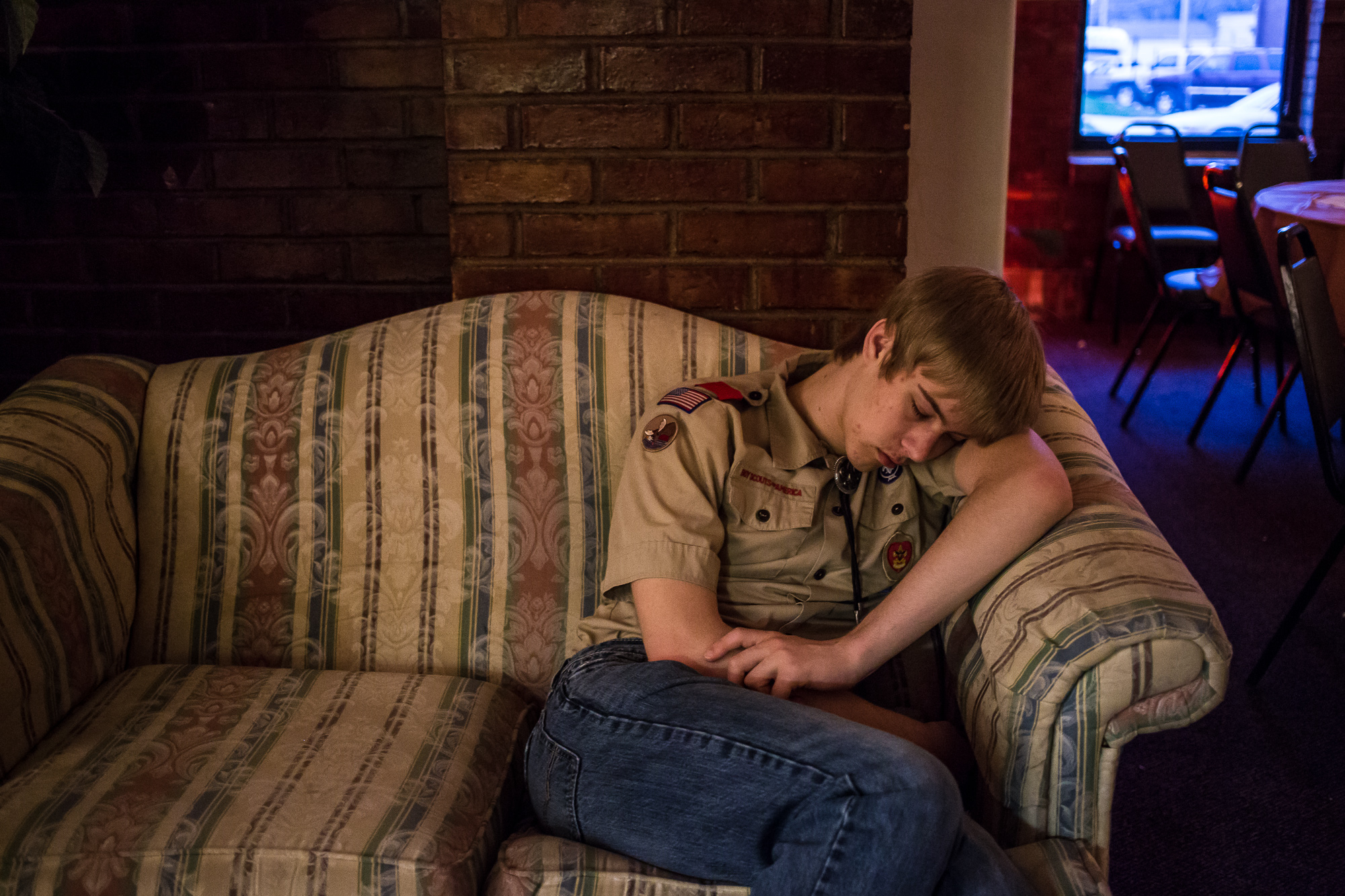  A scout sleeps as Boy Scout Troop 511 holds a mother/son dance on Saturday, April 20, 2013 in Webster City, IA. 