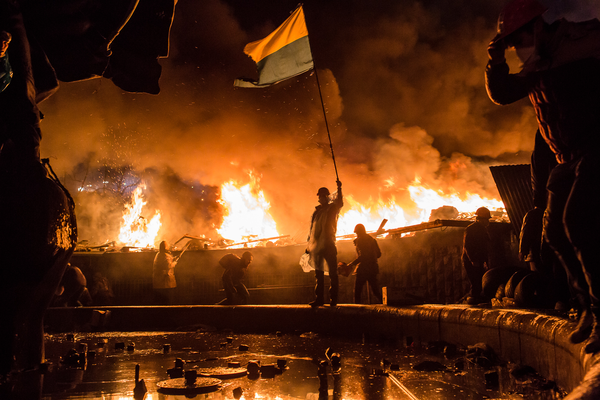  Anti-government protesters guard the perimeter of Independence Square, known as Maidan, on February 19, 2014 in Kiev, Ukraine. After several weeks of calm, violence has again flared between police and anti-government protesters, who are calling for 