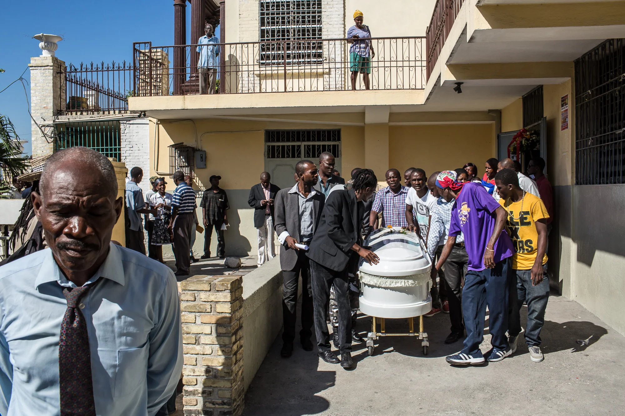 Mourners carry the casket of Jolin Nicolas, 19, on Monday, December 22, 2014 in Port-au-Prince, Haiti. Nicolas was killed by police while participating in anti-government protests on December 13, and many of the mourners came from political groups such as MOPOD, a block of opposition political parties, and Klere J'aie Ayiti that are aligned against President Michel Martelly.